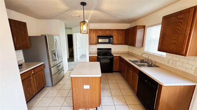 5018 Woodland Meadows Lane, Humble, TX 77346