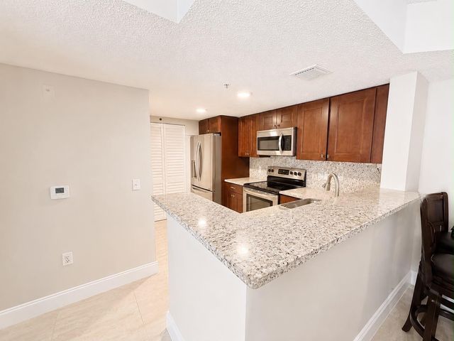 5045 Wiles Road 105, Coconut Creek, FL 33073