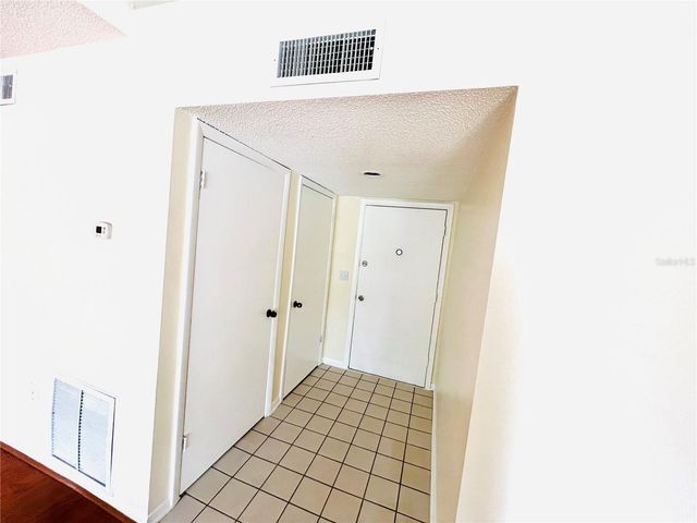 6057 WINDHOVER DRIVE E-08, Orlando, FL 32819
