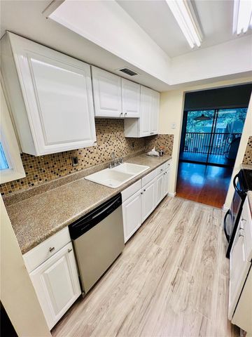 6057 WINDHOVER DRIVE E-08, Orlando, FL 32819
