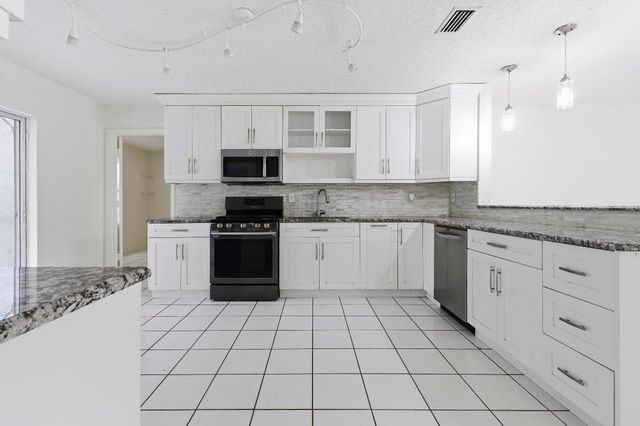 6130 Bluegrass Circle, Greenacres, FL 33463