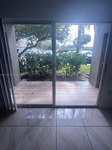 5065 Wiles Road 103, Coconut Creek, FL 33073
