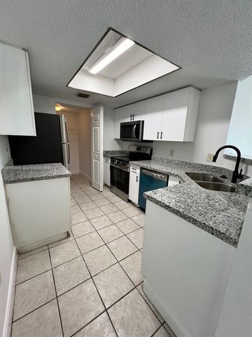 5065 Wiles Road 103, Coconut Creek, FL 33073