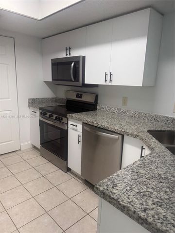5065 Wiles Road 103, Coconut Creek, FL 33073