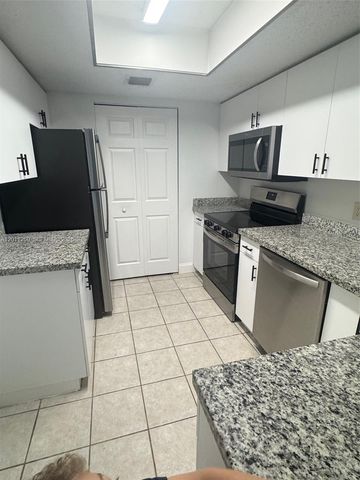 5065 Wiles Road 103, Coconut Creek, FL 33073