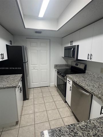 5065 Wiles Road 103, Coconut Creek, FL 33073
