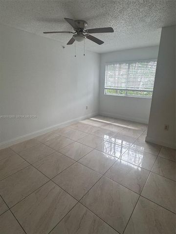 5065 Wiles Road 103, Coconut Creek, FL 33073