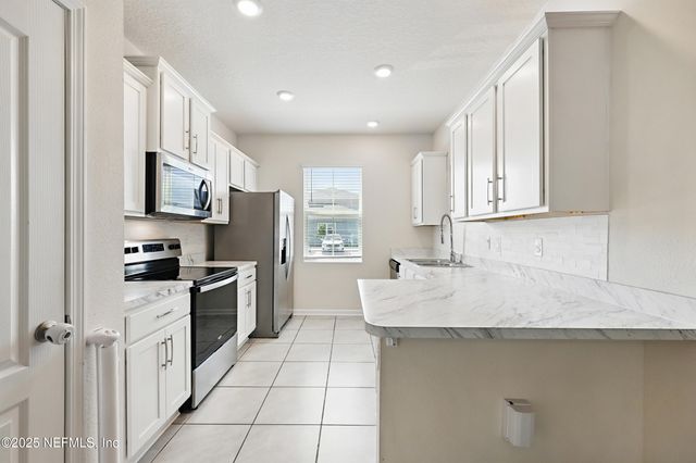 417 RUNNING WOODS Street, Orange Park, FL 32065
