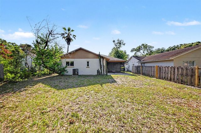 7734 LAKESIDE WOODS DRIVE, Orlando, FL 32810