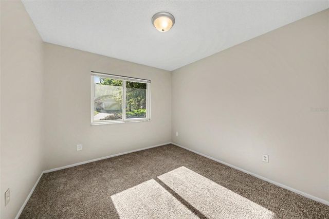 7734 LAKESIDE WOODS DRIVE, Orlando, FL 32810
