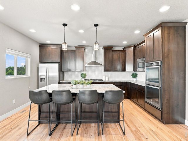 608 Vermilion Peak Dr, Windsor, CO 80550