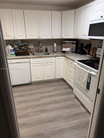 4030 W Palm Aire Drive 104, Pompano Beach, FL 33069