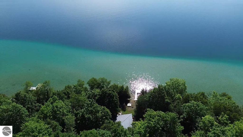 Image 16 of property listing at 7681 NW Torch Lake Drive, Kewadin, MI 49648