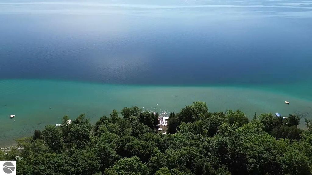 Image 17 of property listing at 7681 NW Torch Lake Drive, Kewadin, MI 49648