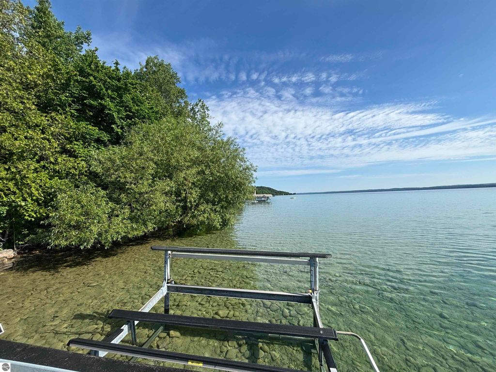 Image 20 of property listing at 7681 NW Torch Lake Drive, Kewadin, MI 49648