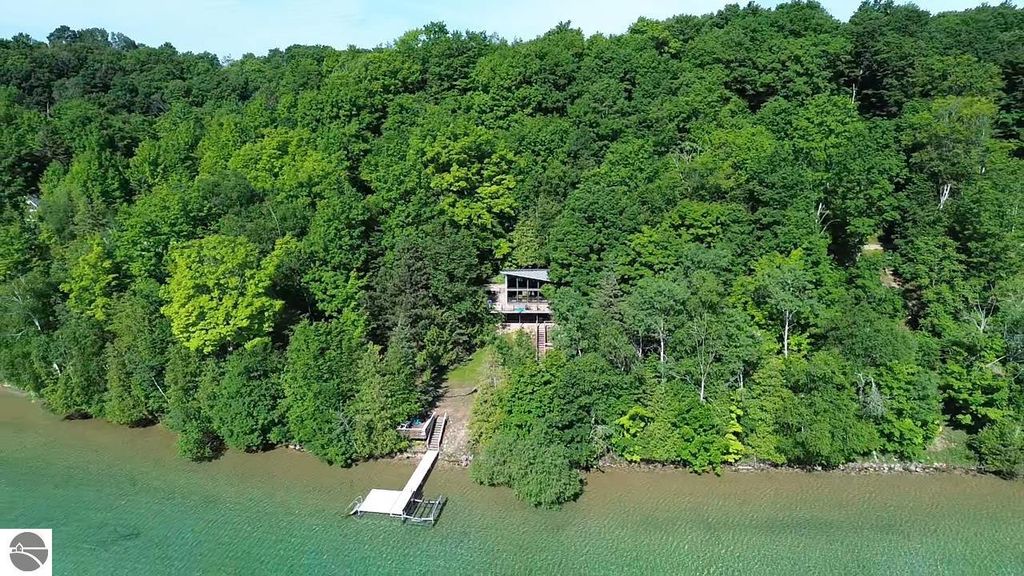 Image 3 of property listing at 7681 NW Torch Lake Drive, Kewadin, MI 49648