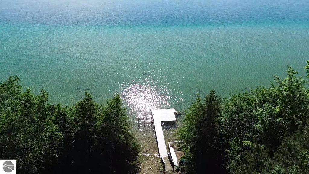 Image 6 of property listing at 7681 NW Torch Lake Drive, Kewadin, MI 49648