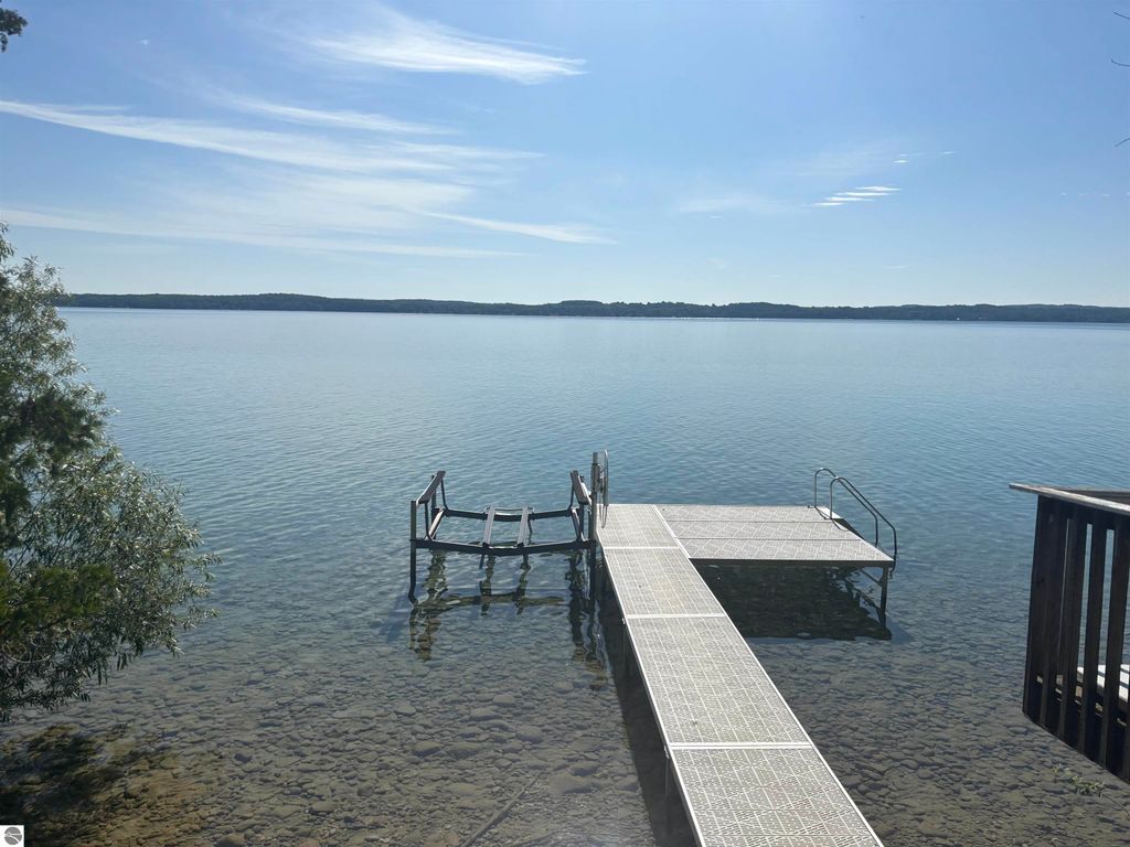Image 7 of property listing at 7681 NW Torch Lake Drive, Kewadin, MI 49648
