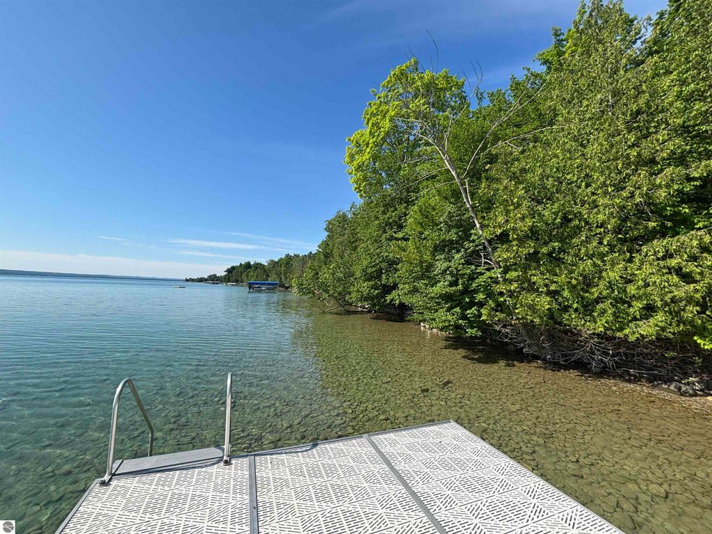 Image 8 of property listing at 7681 NW Torch Lake Drive, Kewadin, MI 49648