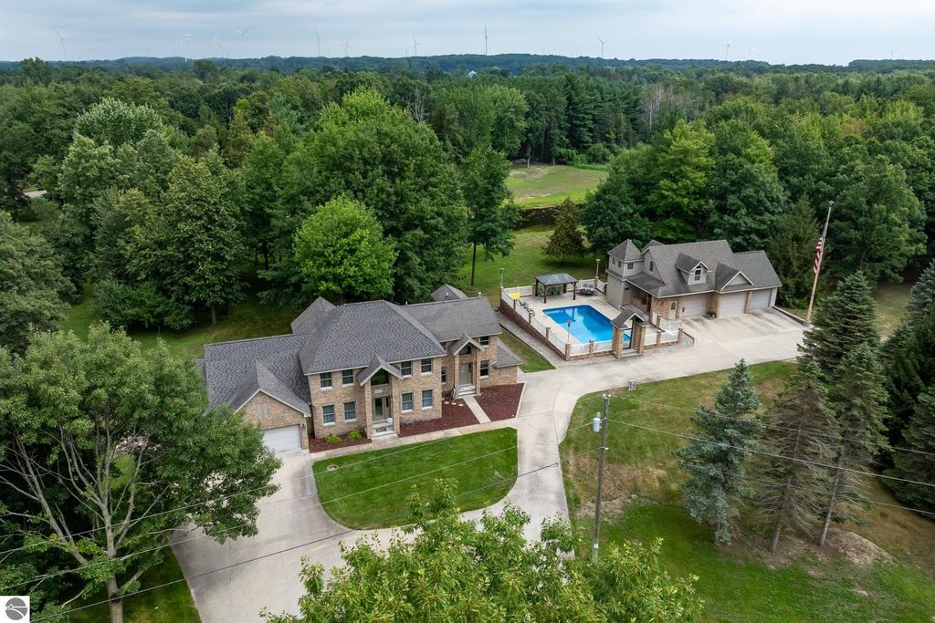 Image 1 of property listing at 900 E Pine Grove Drive, Weidman, MI 48893