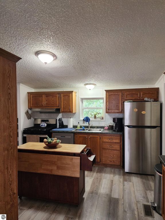 Image 20 of property listing at 3560 Pine Tree Drive, Weidman, MI 48893