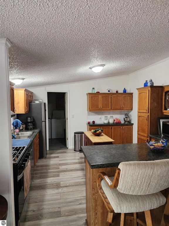 Image 22 of property listing at 3560 Pine Tree Drive, Weidman, MI 48893