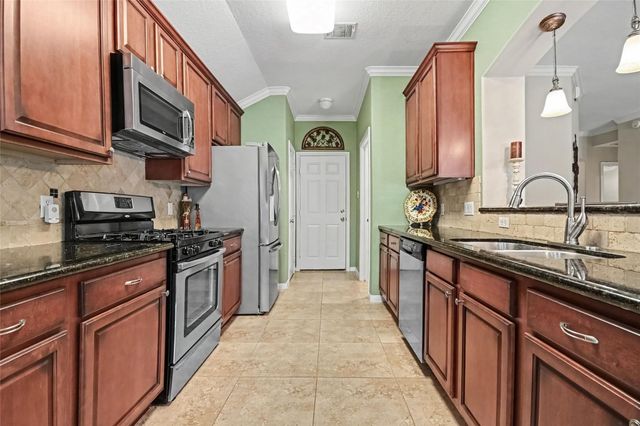 213 Rippling Creek Lane, Alvin, TX 77511