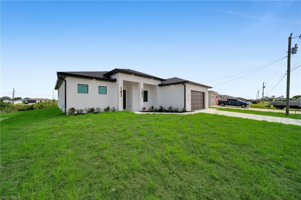 216 NE 25th TER, CAPE CORAL, FL 33909 — exterior