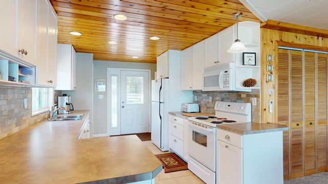 10701 SW Torch Lake Drive, Rapid City, MI 49676