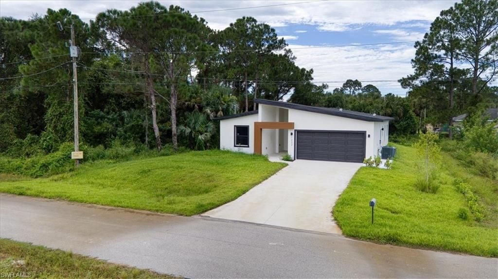 1222 Hilliard ST E, LEHIGH ACRES, FL 33974 — exterior