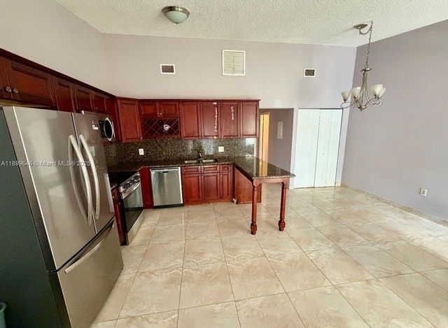 5797 S 37th St, Green Acres, FL 33463