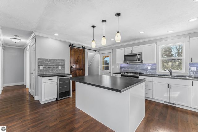 7423 Scotchwood Lane, Grawn, MI 49637