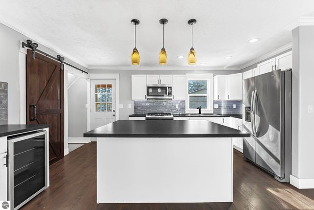 7423 Scotchwood Lane, Grawn, MI 49637