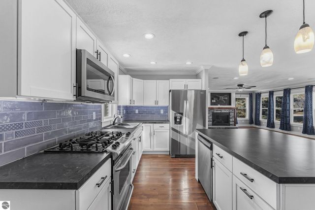 7423 Scotchwood Lane, Grawn, MI 49637