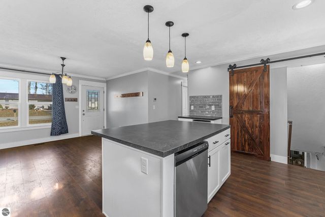 7423 Scotchwood Lane, Grawn, MI 49637