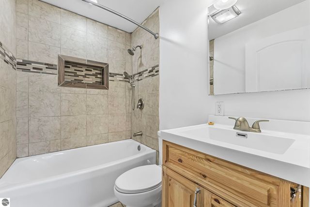 7423 Scotchwood Lane, Grawn, MI 49637