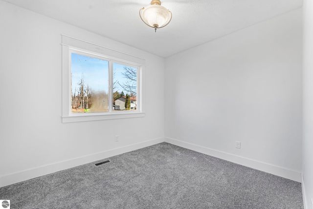 7423 Scotchwood Lane, Grawn, MI 49637