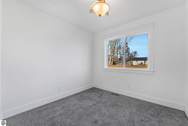 7423 Scotchwood Lane, Grawn, MI 49637