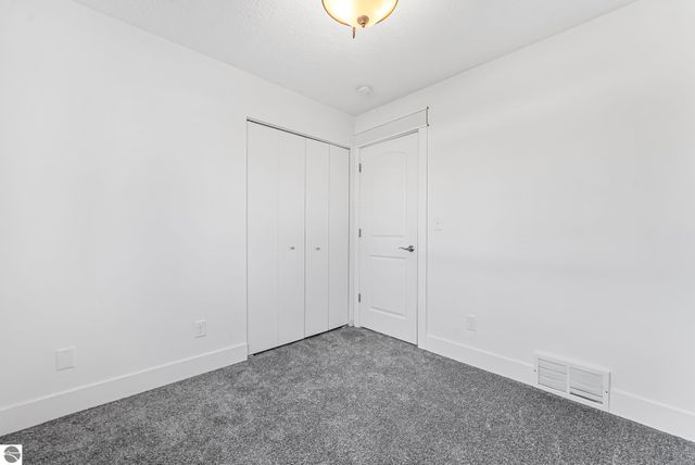 7423 Scotchwood Lane, Grawn, MI 49637