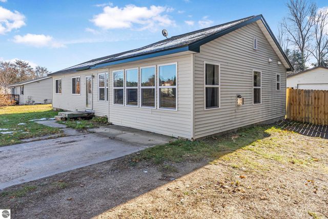 7423 Scotchwood Lane, Grawn, MI 49637