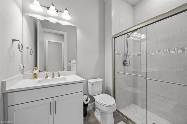 7716 Winding Cypress DR, Naples, FL 34114