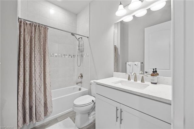 7716 Winding Cypress DR, Naples, FL 34114