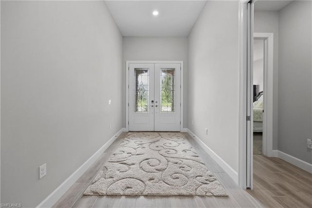 7716 Winding Cypress DR, Naples, FL 34114