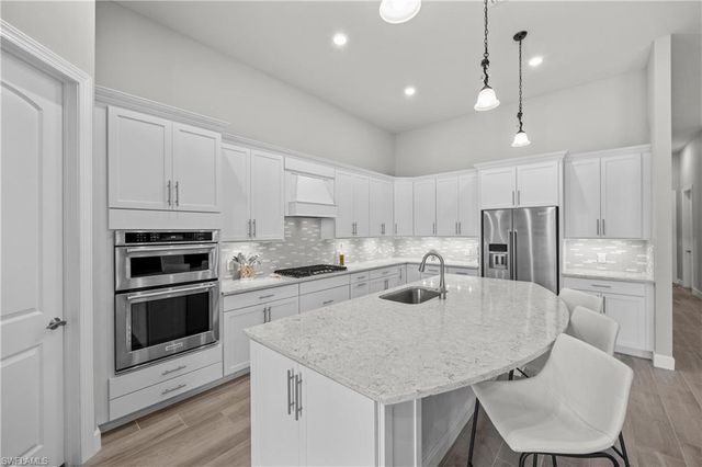 7716 Winding Cypress DR, Naples, FL 34114