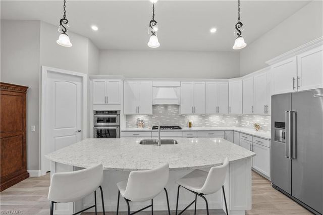 7716 Winding Cypress DR, Naples, FL 34114