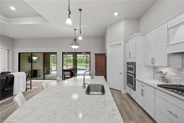 7716 Winding Cypress DR, Naples, FL 34114