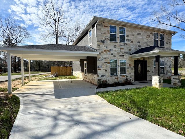 10594 Rustling Oaks Drive, Conroe, TX 77303