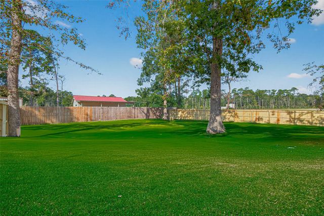 10594 Rustling Oaks Drive, Conroe, TX 77303