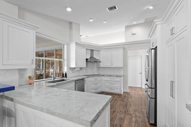 9061 Cypress Hollow Drive, Palm Beach Gardens, FL 33418