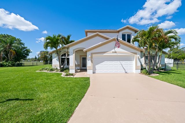 112 Camelot Court, Royal Palm Beach, FL 33411